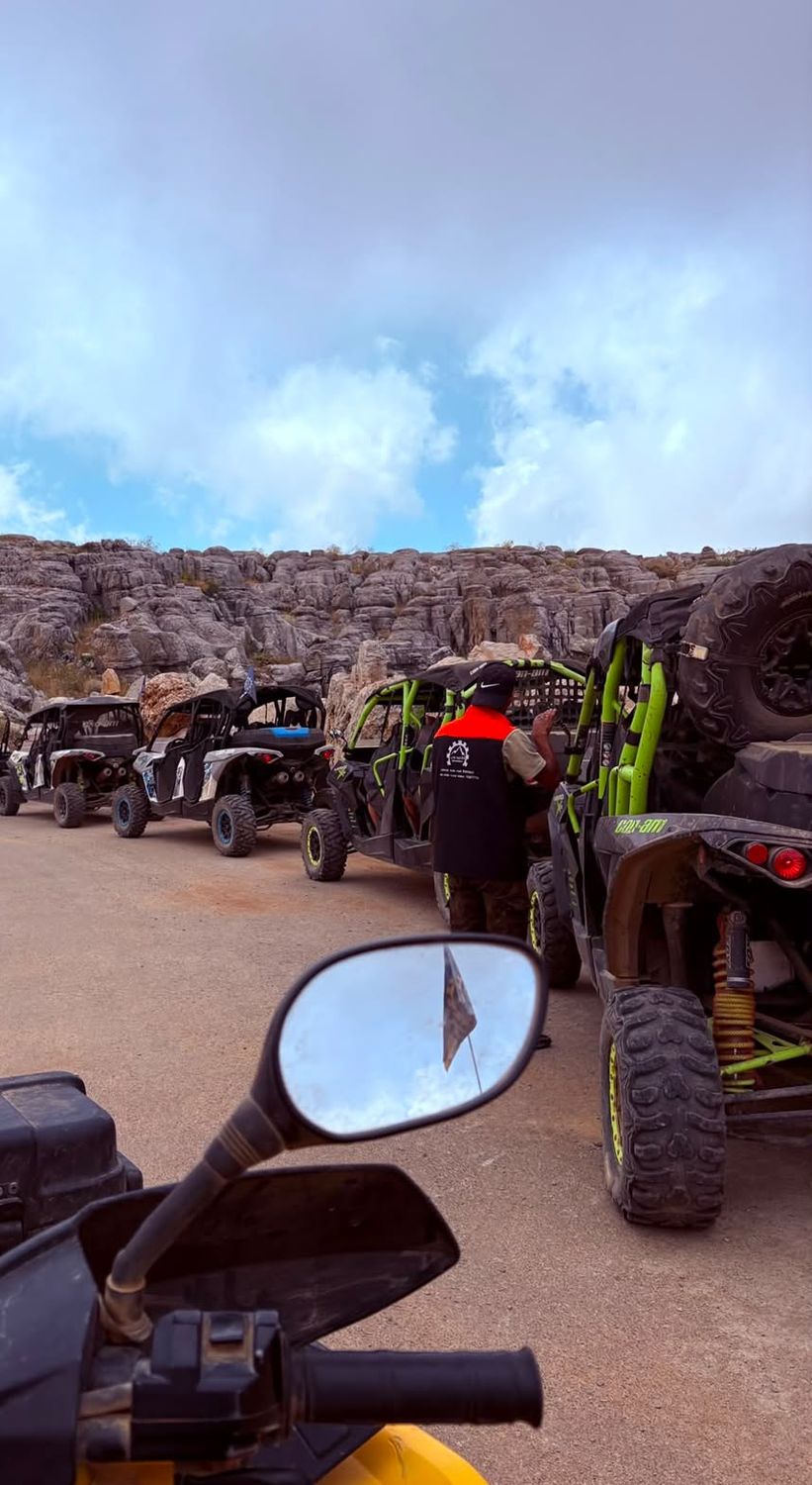 Riding past a cliff line from an ATV